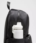 Everywhere Backpack 22L in black showing side bottle pocket