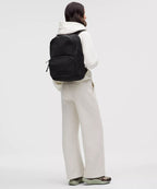 Everywhere Backpack 22L in black worn by a woman