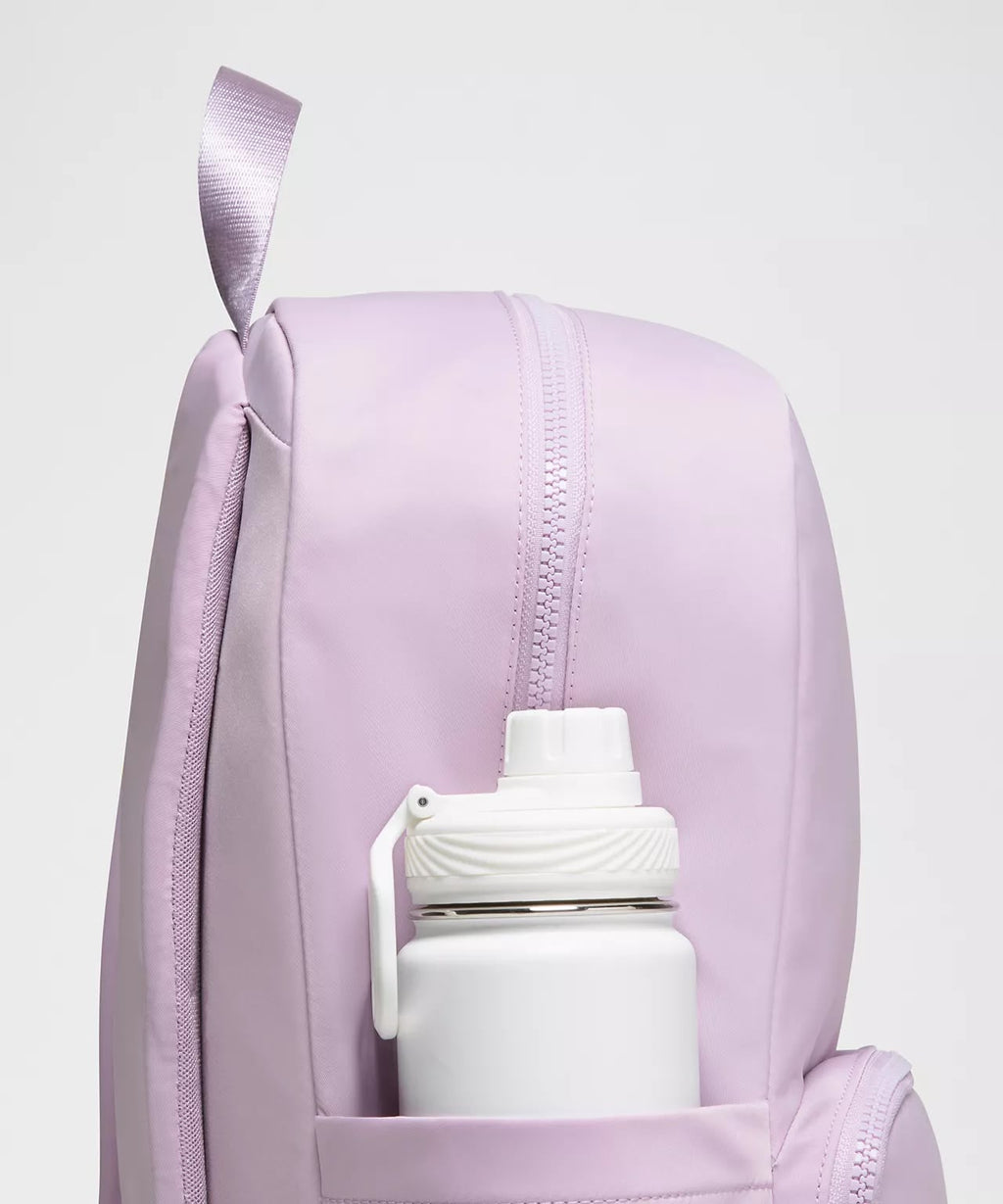 Everywhere Backpack 22L in pink showing side bottle pocket