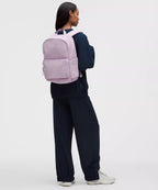 Everywhere Backpack 22L in pink worn by a woman